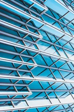 Underside panoramic and perspective view to steel blue glass high rise buildi Stock Photos