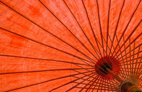 Underside of red fabric umbrella Stock Photos