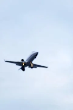 The underside of a small landing airplane Stock Photos