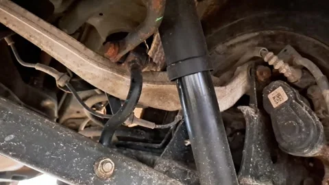 Underside Vehicle Suspension View with Shock Absorber and Control Arm Video stock 331840660