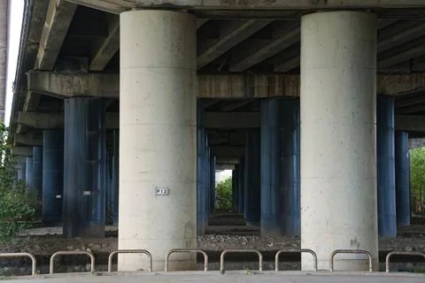 Underside View of Elevated Highway With Numbered Concrete Piers 스톡 사진