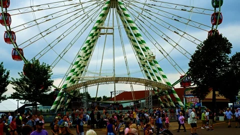 Underside view of a ferris wheel at Minnesota State Fair on a cloudy day Stock Footage 95240465