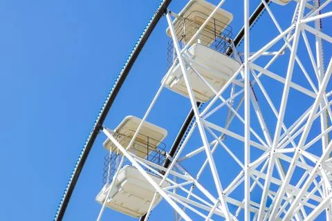 Underside view of a ferris wheel rotating downward Stock Photos