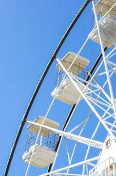 Underside view of a ferris wheel rotating downward Stock Photos