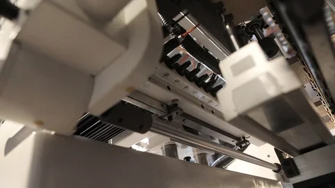 Underside view of the machine of the doing holes in details of cabinet furniture Stock-Footage 91683256