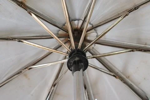 Underside View Of Open White Umbrella With Ribs Metal Pole And Black Fitting Stock Photos