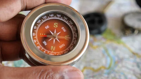 Understanding compass navigation in outd... | Stock Video | Pond5
