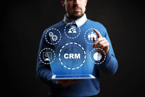 Understanding CRM through digital tools and visual aids by a business profe.. Stock Photos