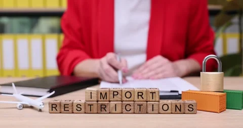 Understanding import restrictions and their impact on trade practices in a busy Stock Footage 319069071