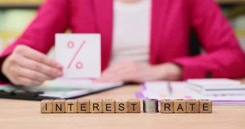 Understanding interest rates with hands-on examples in a bright office setting Stock Footage 319066806