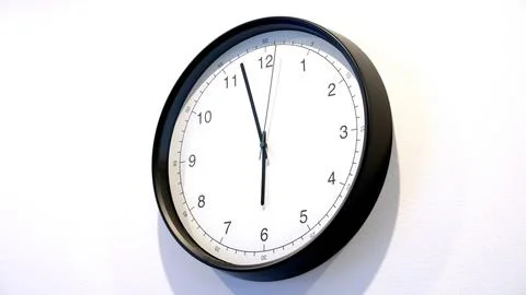 Understanding Time Management With a Wall Clock Featuring a Second Hand Stock Photos