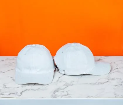 The understated elegance of a white blank hat shines in this captivating mo.. Stock Photos