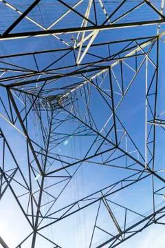 Underview of Structured  Metal Engineering of Overhead Electricity Pylon Stock Photos