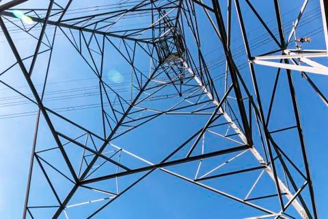 Underview of Structured  Metal Engineering of Overhead Electricity Pylon Stock Photos