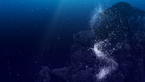 Underwater air bubbles dance in front of rocks  (Loop) Stock Footage 83452172
