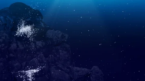 Underwater air bubbles dance in front of rocks  (Loop) Stock Footage 83479234