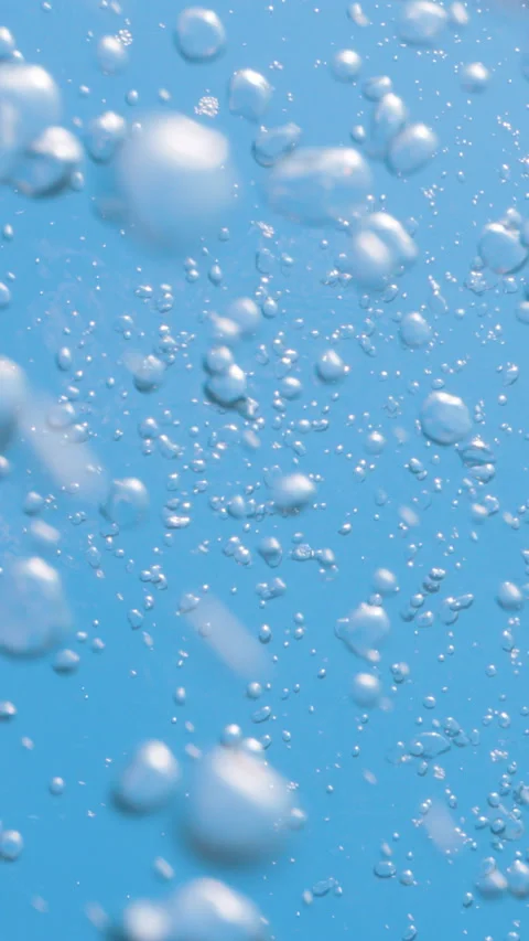 Underwater air bubbles rising from deep water up to the surface in tropical sea Stock Footage 284007050