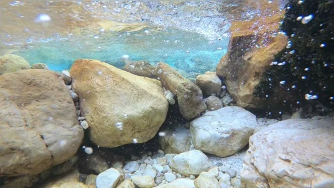 Underwater: Amazing mountain river flow with bubbles and turquoise water Stock Footage 94464461