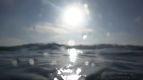 Underwater and over the waves breaking in the surf at the beach. Stock Footage