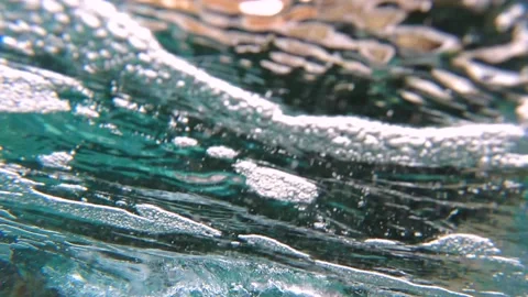 The underwater angle of tropical blue ocean waves breaking on the reef. Splash f Stock Footage 169908209