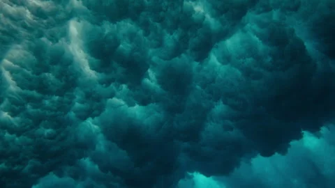Underwater breaking wave dense foam bubbles pulsating cloud formation Stock Footage 333445780