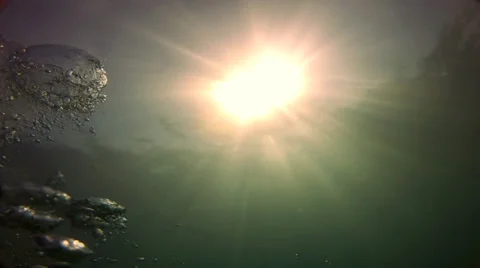 Underwater bubbles and sun Stock Footage
