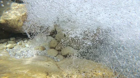 Underwater bubbles from a mountain river, pure water Stock Footage 94444967