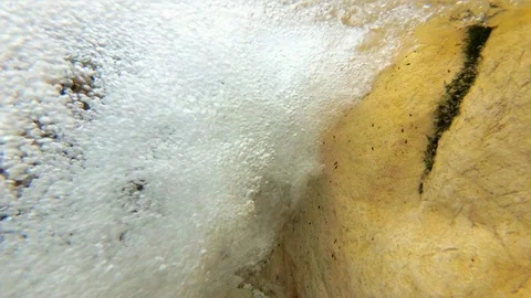 Underwater bubbles from a mountain river waterfall, pure water, slow motion Stock Footage 94453043