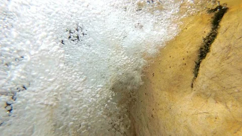 Underwater bubbles from a mountain river waterfall, pure water. Slow motion Stock Footage 98222432