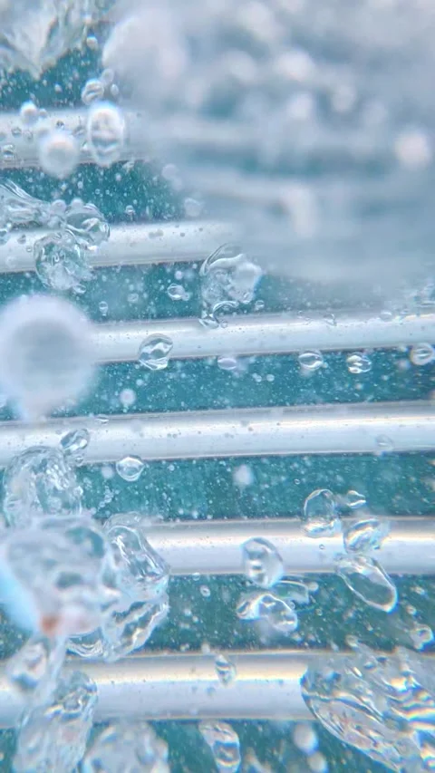 Underwater bubbles rising around pool ladder in swimming pool Stock Footage 342157757