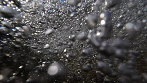 Underwater bubbles rushing back out to sea with the tide 스톡 동영상 221991509