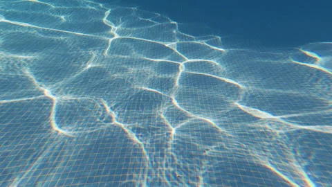 Underwater Camera Movement Across Swimming Pool Floor with Sunlight Caustics 動画素材 342326523