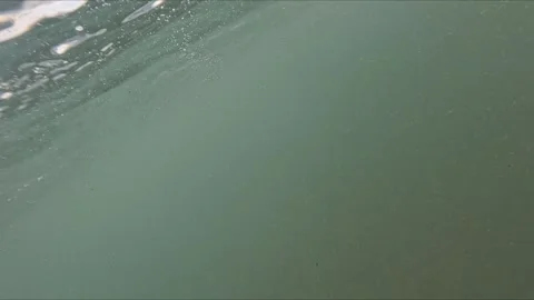 Underwater camera view simulating a person going down into the sea with bub.. Video stock 318062175