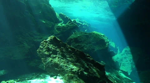 An Underwater Cave Illuminated By Rays Of Sunlight 4K Stock Footage 66549062