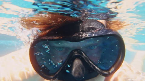Underwater Close Up Of Person With Diving Mask And Air Bubbles Leaving Mouth In Stock Footage 332300938