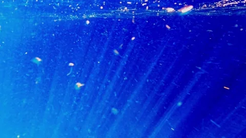 Underwater deep blue ocean with bubbles and light rays, slow motion Stock Footage 279430950