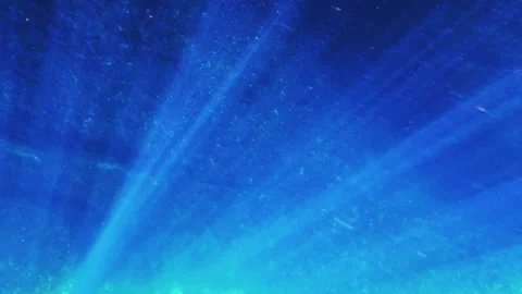 Underwater deep blue ocean with light rays illuminating seafloor, slow motion Vídeos de archivo 279431016