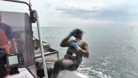 UNDERWATER DIVING FROM THE BOAT WITH A BACKCOK Stockbeeldmateriaal 81221353