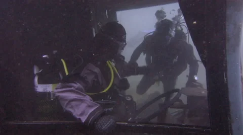 Underwater fun on a bus wreck - pretending to drive the bus 2! Stock Footage 48580077