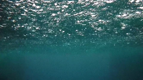 UNDERWATER: Heavy raining view from the ocean Stock Footage 75264592