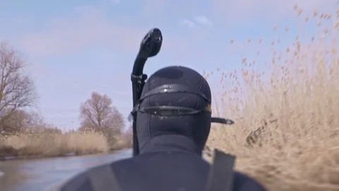 Underwater hunter boating on the river in spring or autumn Stock Footage 102806567