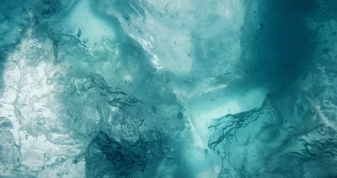 Underwater ice with rising water bubbles. 4K Stock Footage