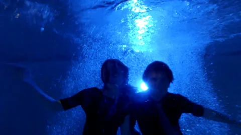 Underwater Jump In Pool At Night Stock Footage