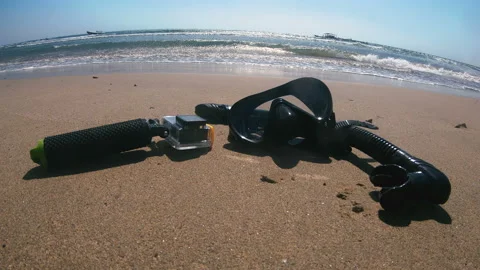 Underwater mask and action camera on the sand near the sea Stock Footage 107347155