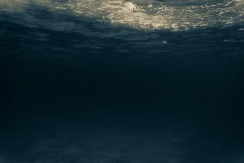 The underwater ocean with the rays of the sun. sandy bottom. Stock Photos