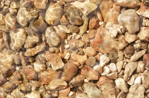 Underwater pebbles Stock Photos