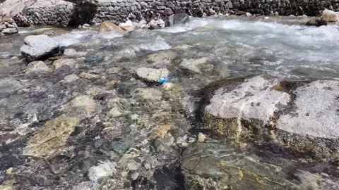 Underwater Perspective Close-Up View of Flowing River Water, Featuring Large Stock Footage 288468930