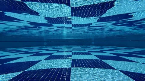 Underwater pool camera capture shows beautiful rippling water patterns, light Stock Footage 321764554