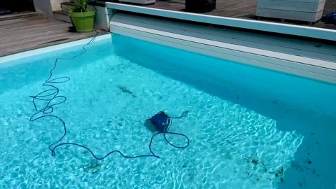 Underwater pool vacuum cleaner in a private house with bioclimatic pergola Stock Footage 244546926