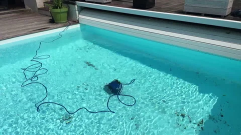 Underwater pool vacuum cleaner in a private house with bioclimatic pergola Stock Footage 244547909